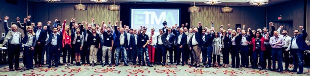 Group photo of professionals celebrating at an ETMA event.