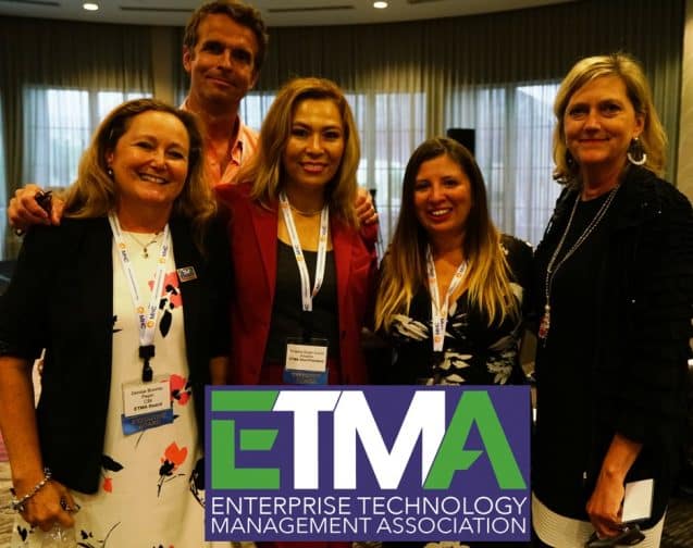 Group of professionals posing at the Enterprise Technology Management conference.